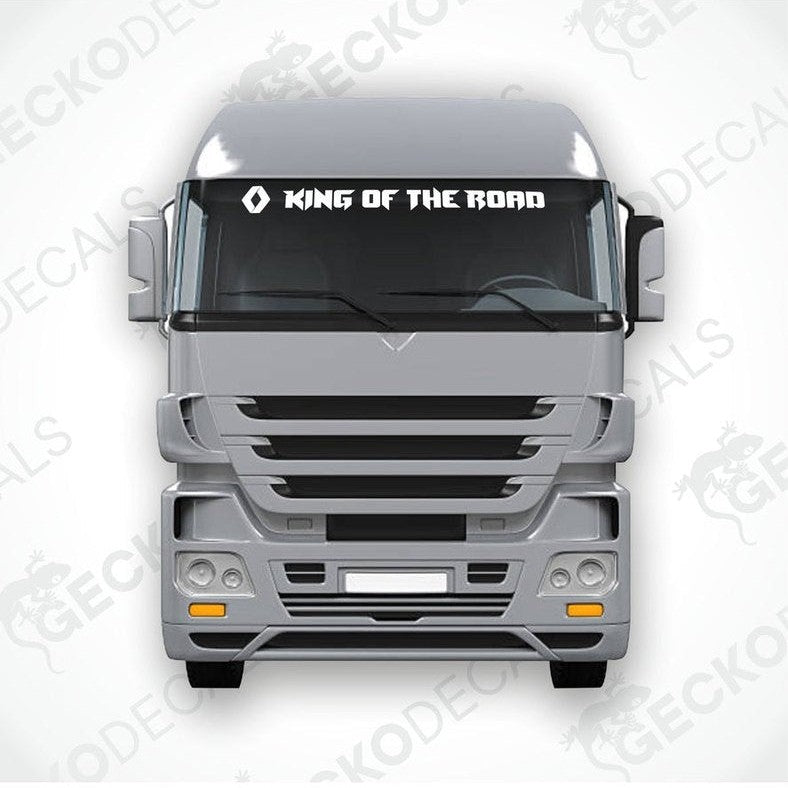 A die cut decal with the phrase 'KING OF THE ROAD' positioned on the windshield of a gray RENAULT truck.