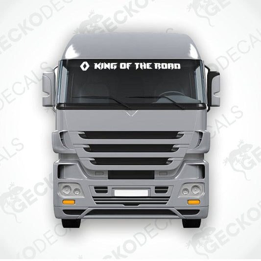 A die cut decal with the phrase 'KING OF THE ROAD' positioned on the windshield of a gray RENAULT truck.