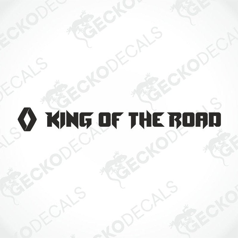 A die cut decal with the phrase 'KING OF THE ROAD' positioned on the windshield of a gray RENAULT truck.
