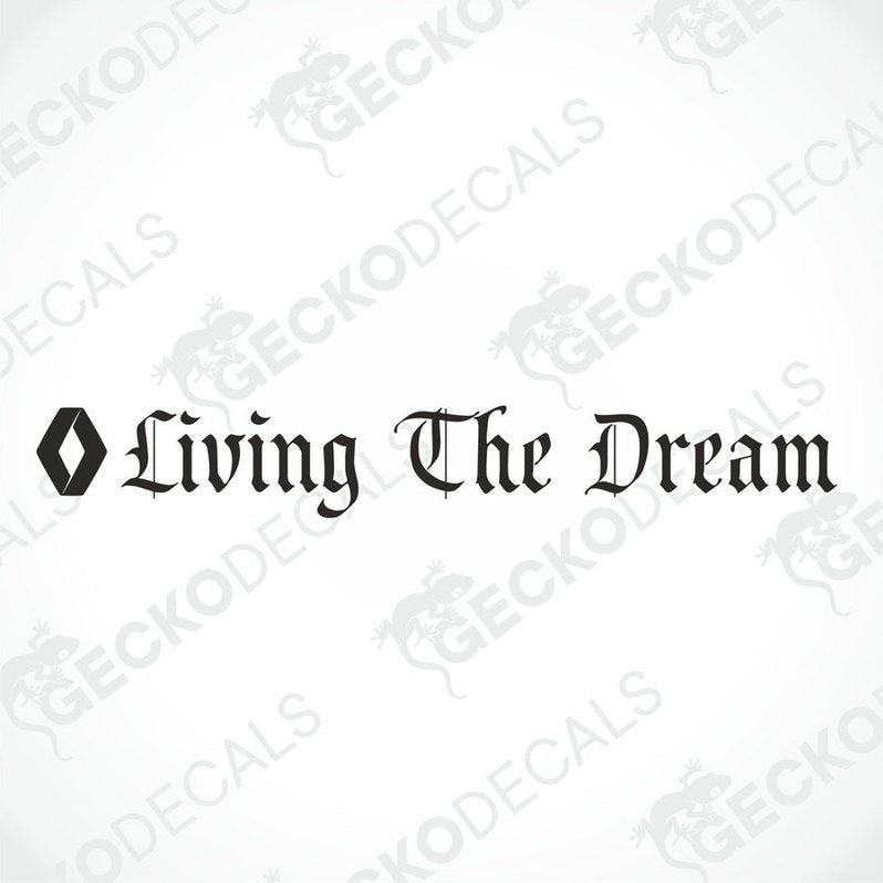 A die cut decal with the phrase 'Living The Dream' positioned on the windscreen of a gray RENAULT truck.