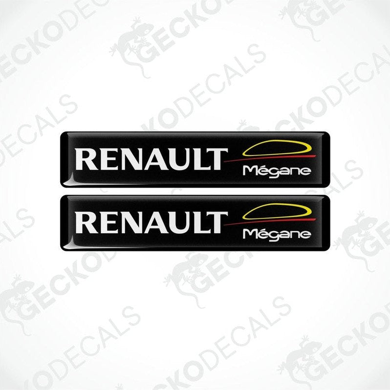 Two black vinyl stickers with the RENAULT brand and MEGANE model name, featuring red and yellow accents.
