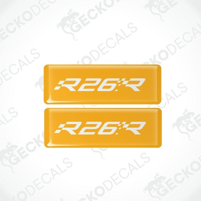 Two yellow rectangular vinyl decals with 'R26.R' withe text on them, intended for use as car stickers.