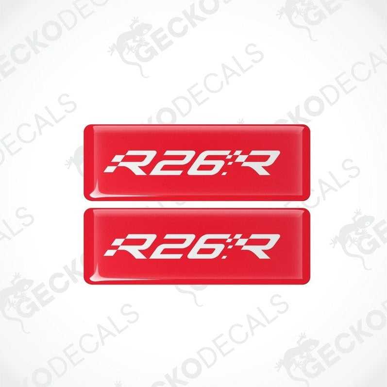 Two red rectangular vinyl decals with 'R26.R' withe text on them, intended for use as car stickers.