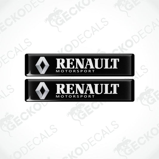 Two black vinyl stickers with the Renault Motorsport logo printed on them.