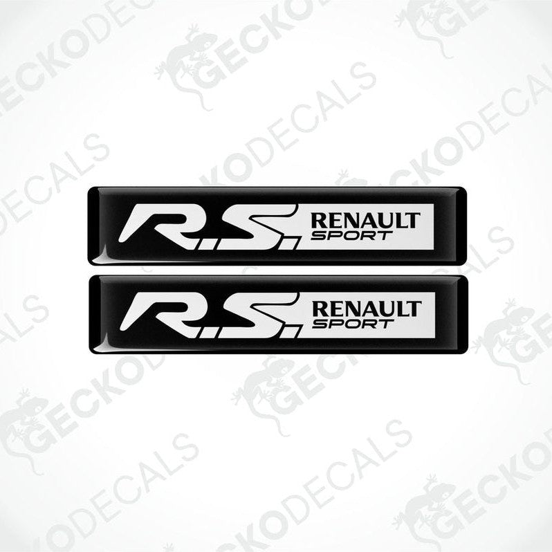 Two black and white vinyl decals with 'RS Renault Sport' text on them, placed on a white background.