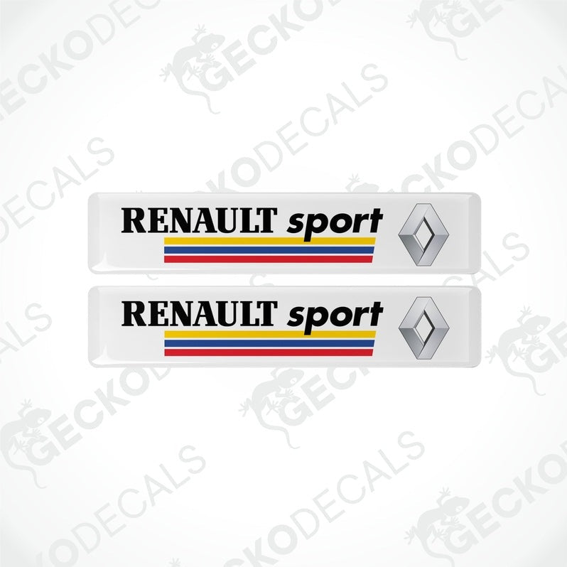 Two withe rectangular vinyl decals with the text 'RENULT sport' and the Renault logo in black, yellow, and red.