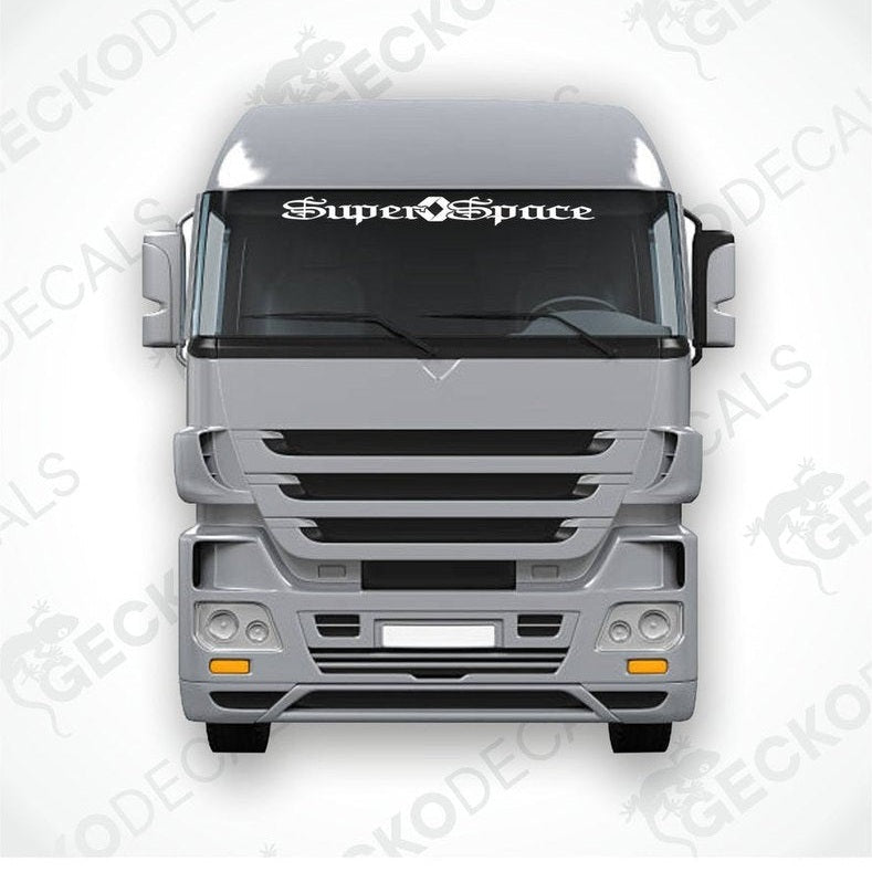 A die cut decal with the text 'Super Space' displayed on the upper part of a truck's windscreen.
