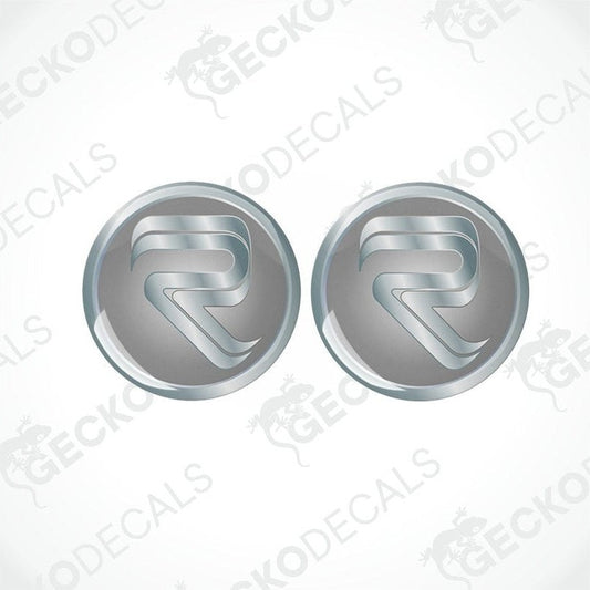 Two round vinyl stickers with a metallic finish and the Rimor logo in the center, placed on a white background with the Gecko Decals logo.