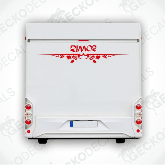 A white caravan with a red and black 'Rimor' brand decal on the rear side.