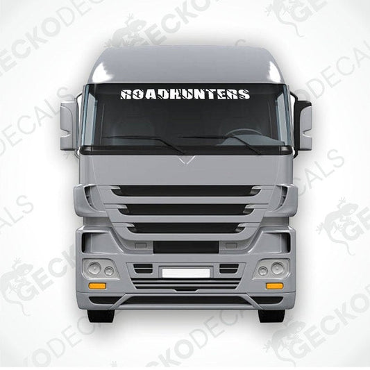 A die cut decal with the text 'ROADHUNTERS' displayed on the front of a gray truck's windscreen.