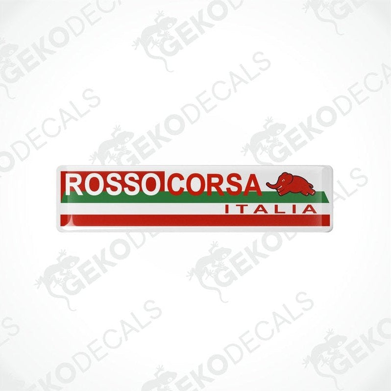 Vinyl stickers with red, white, and green colors, featuring the text 'ROSSO CORSA ITALIA' and a green dinosaur logo.

