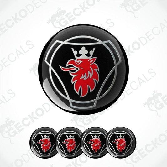 Set of car wheel hubcaps with a red lion emblem on a white background.