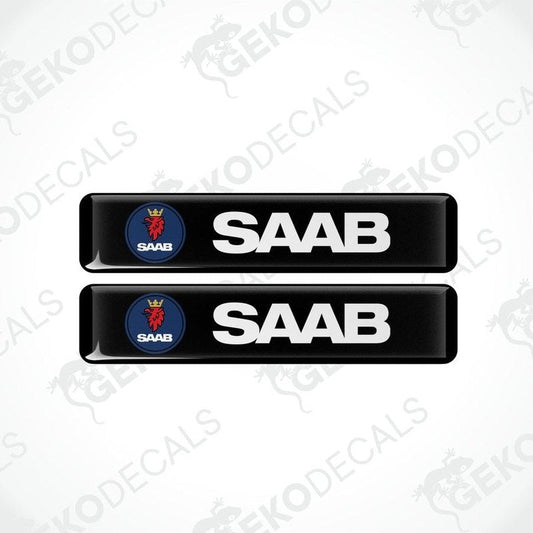 Two black vinyl decals with polyurethane coating featuring the SAAB logo in white lettering.