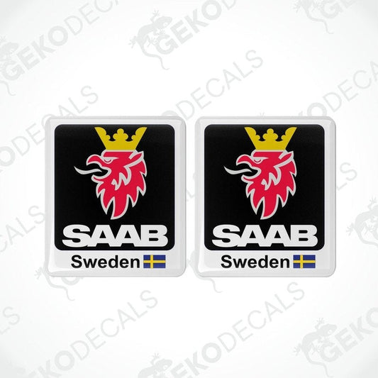 Two domed vinyl stickers with a red and black design, featuring the SAAB brand logo and the text 'SWEDEN'.