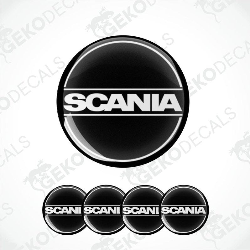 A set of four black, white, and gray vinyl stickers with the word 'SCANIA' printed on them.