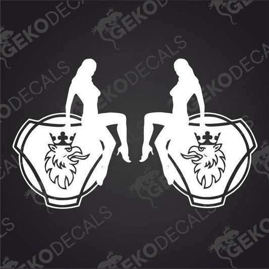 A set of two black and white vehicle decals featuring a stylized female figure sitting on a vehicle, with the brand name 'Scania' and a crown emblem.