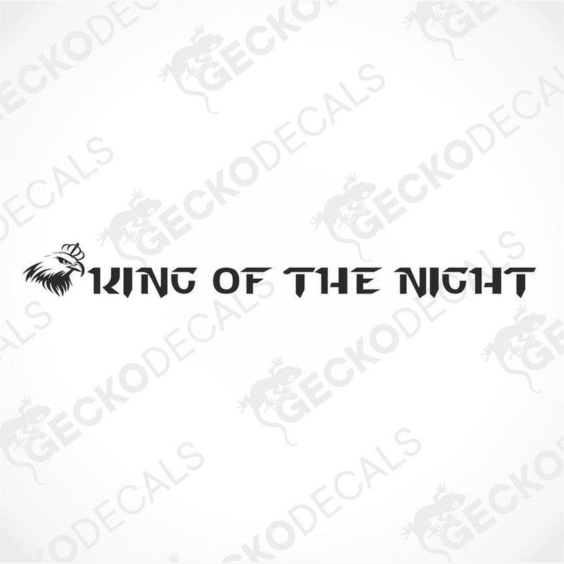 A die cut sticker with the text 'KING OF THE NIGHT' placed on the windscreen of a gray Scania truck.