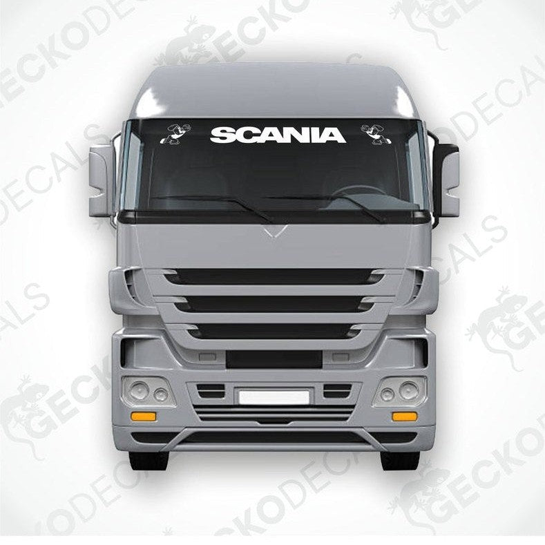 A front view of a Scania truck with a 'Popeye' windscreen decal displayed on the windshield.