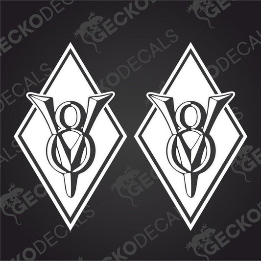 Two white vehicle decals with a geometric design, featuring the letters V8 and X8, on a black background.