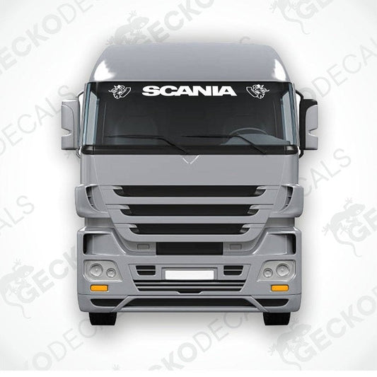 A front view of a Scania truck with the brand name 'SCANIA' displayed on the windscreen.