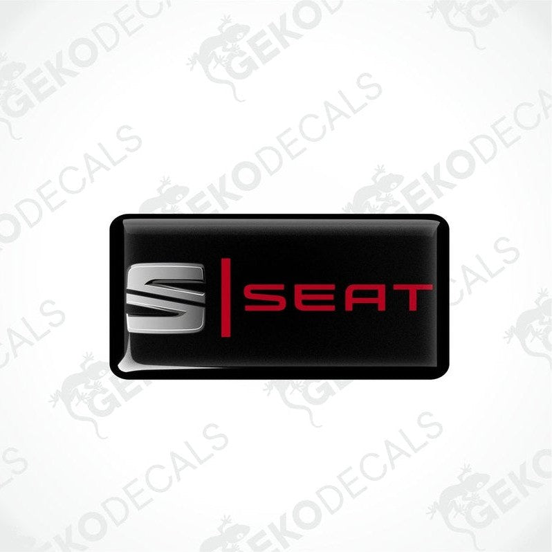 Black vinyl stickers with the word 'SEAT' in red and white.