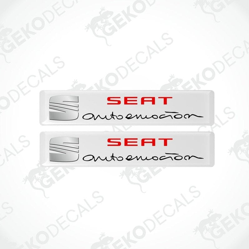 Two withe vinyl decals with polyurethane coating featuring the SEAT AUTOEMOUTION logo in black lettering.