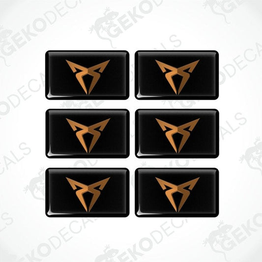 A set of six black vinyl stickers with a gold or bronze geometric design, arranged in a grid pattern.