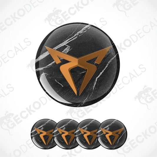 Set of black circular stickers with a gold geometric logo on a white background.