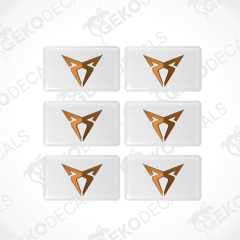 A set of six withe vinyl stickers with a gold or bronze geometric design, arranged in a grid pattern.