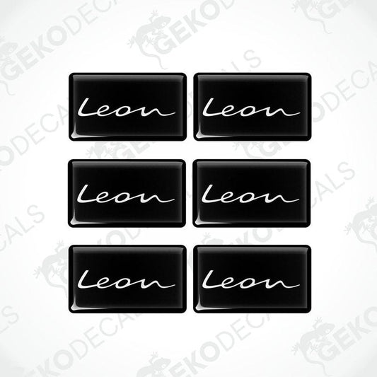 A set of six black vinyl decals with the text 'Leon' on them, arranged in two rows with three decals in each row.