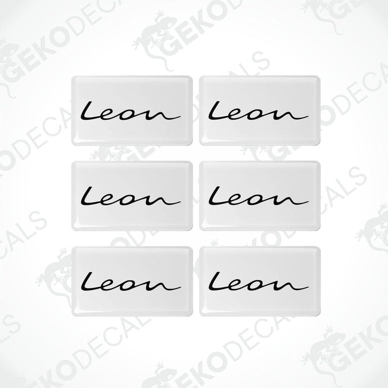 A set of six withe vinyl decals with the text 'Leon' on them, arranged in two rows with three decals in each row.