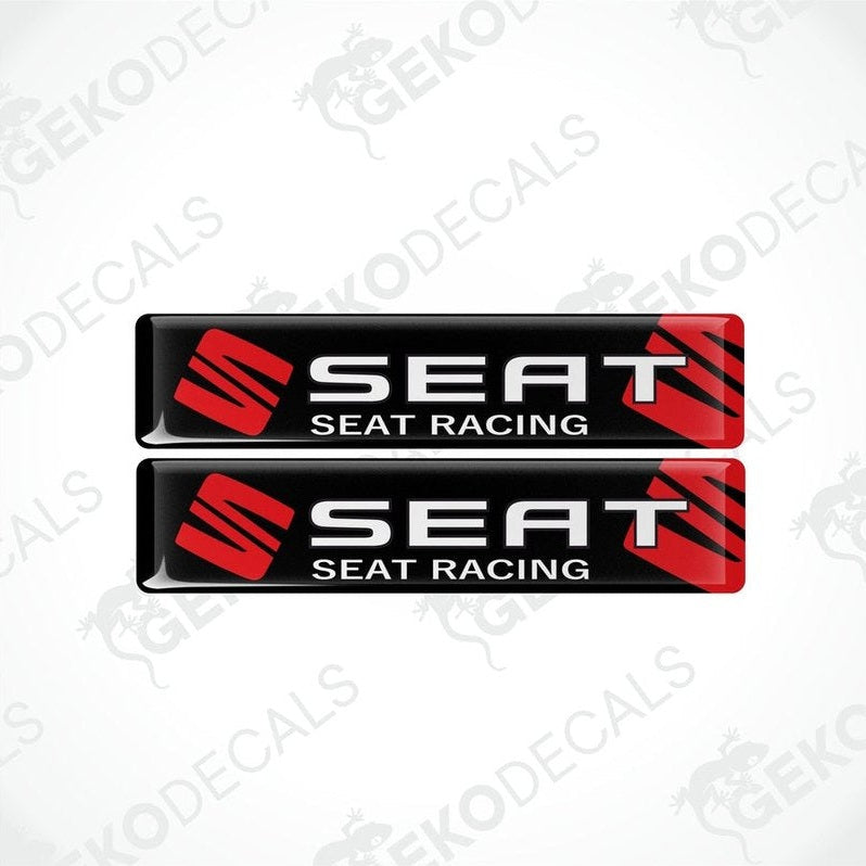 Two black, red, and white vinyl stickers with the text 'SEAT RACING' printed on them.