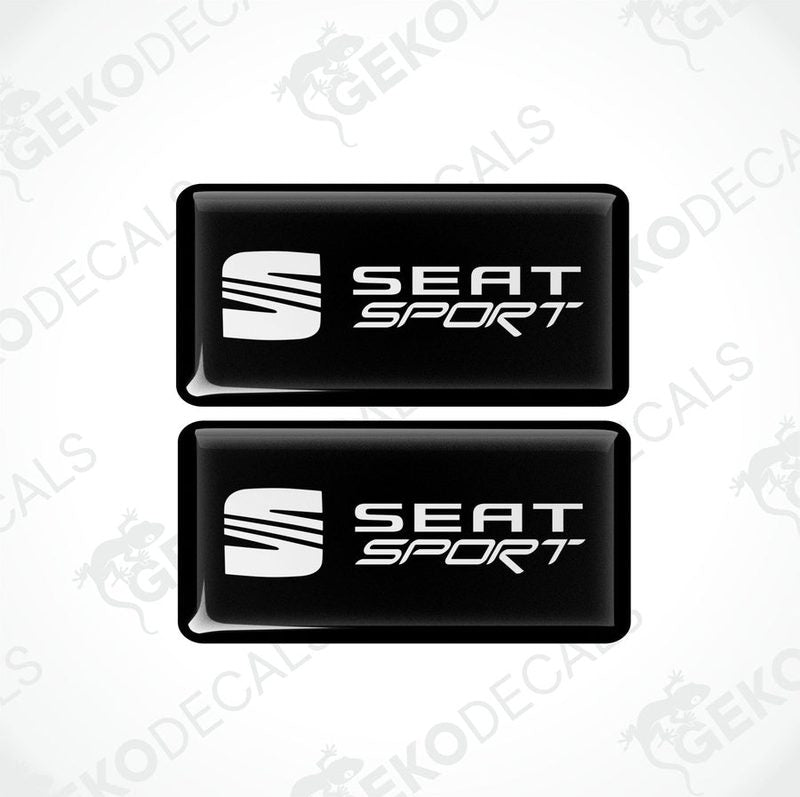 Two black rectangular car decals with the white text 'SEAT SPORT' on them.