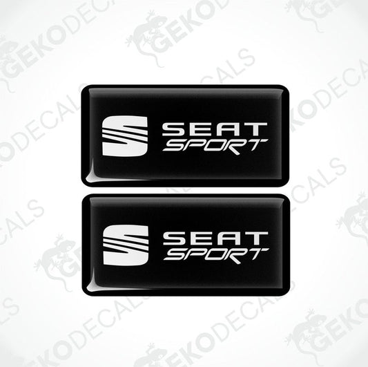 Two black rectangular car decals with the white text 'SEAT SPORT' on them.