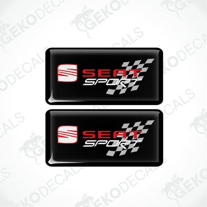 Two rectangular black vinyl decals with the 'SEAT SPORT' logo in white and red, and a checkered design.