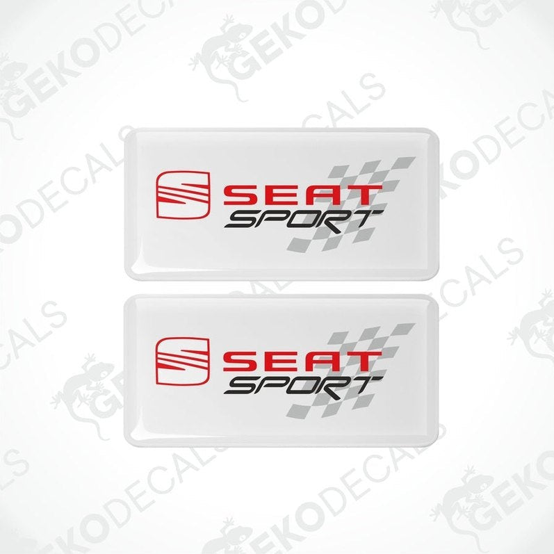 Two rectangular withe vinyl decals with the 'SEAT SPORT' logo in black and red, and a checkered design.