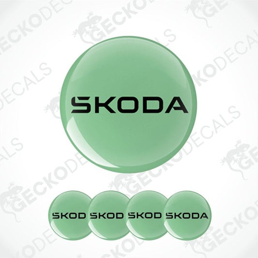 Set of green Skoda logo decals on a white background