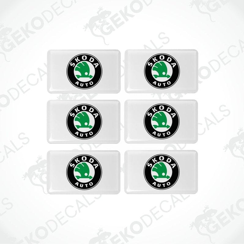A set of six withe vinyl stickers with the Škoda Auto logo in green and black
.