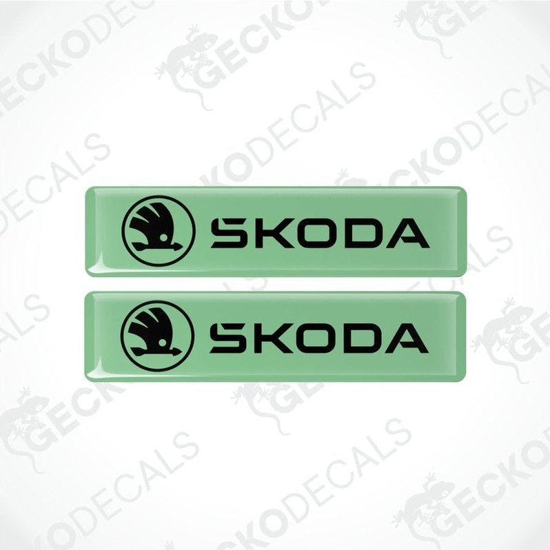 Two green Skoda logo decal stickers on a white background with 'Gecko Decals' branding.