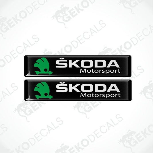 Two black, green, and white decals with the Skoda Motorsport logo.