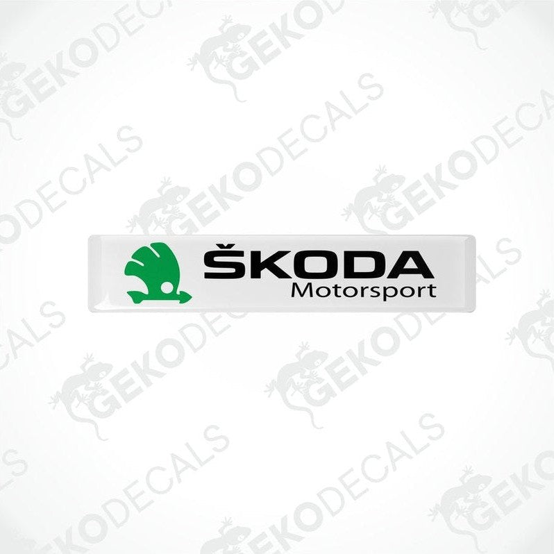 Withe, green, and black decals with the Skoda Motorsport logo.