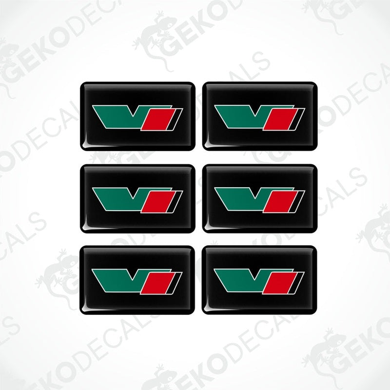 A set of six green, red, and black vinyl stickers with a geometric design and the brand name ŠKODA VRS.