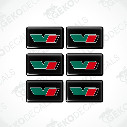 A set of six green, red, and black vinyl stickers with a geometric design and the brand name ŠKODA VRS.