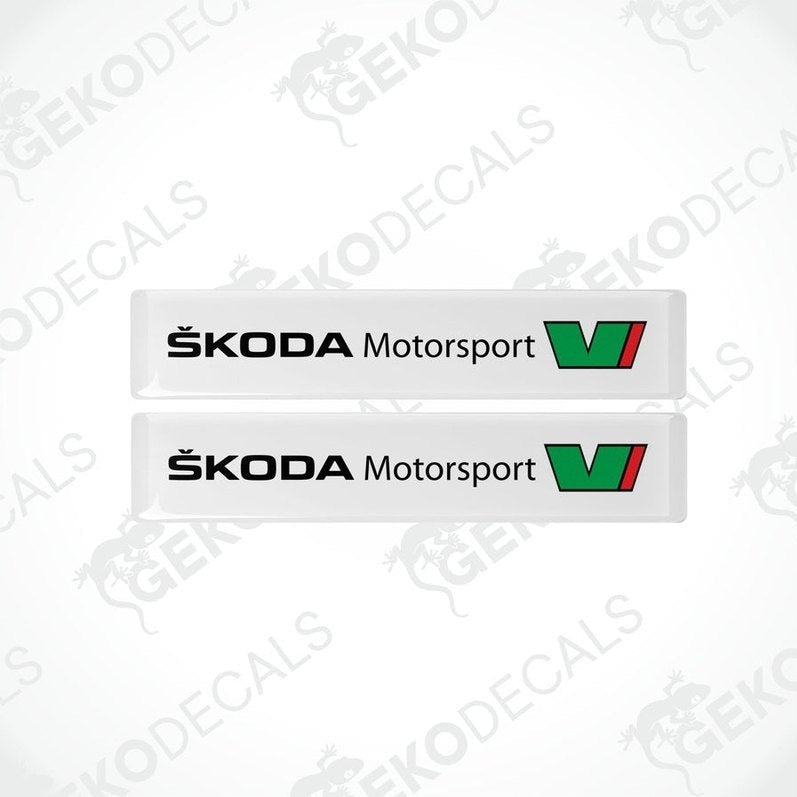 Two withe rectangular decals with the Skoda Motorsport logo in green and black.