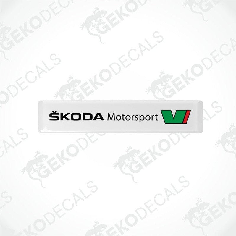 Withe rectangular decals with the Skoda Motorsport logo in green and black.