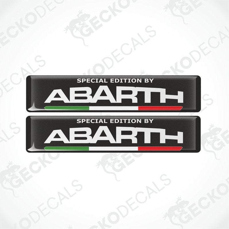 Two vinyl decals with polyurethane coating featuring the text 'SPECIAL EDITION BY Abarth' on a black background with the Abarth logo and the Italian flag colors.