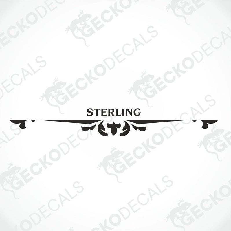 A white caravan with a red and black 'STERLING' decal on the rear side.