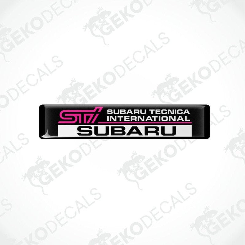  Rectangular black decals with 'STI SUBARU TECNICA INTERNATIONAL' text in pink and white.