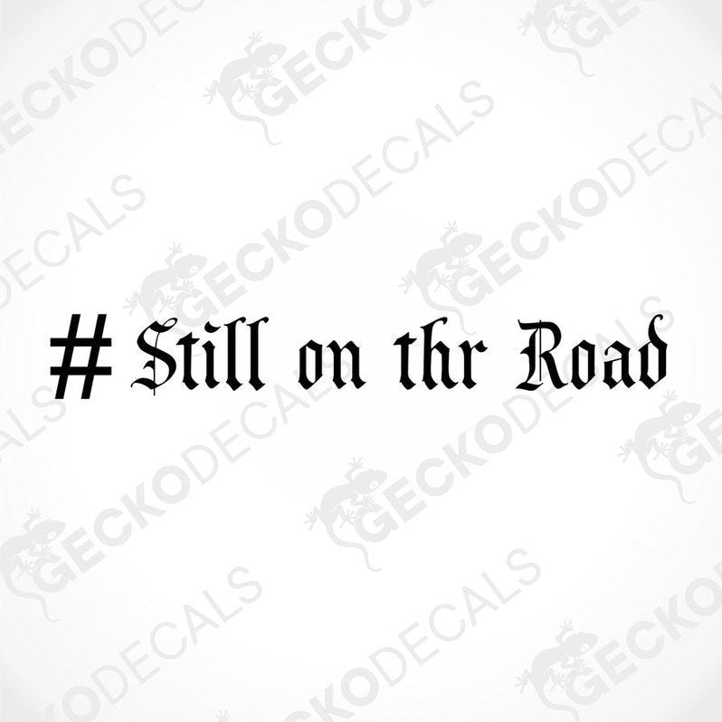 A die cut sticker with the text '# STILL ON THE ROAD' displayed on a white background, with a Gecko Decals logo at the bottom.