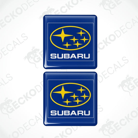 Two blue vinyl stickers with the SUBARU brand logo and stars.